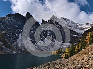 View of Lake Agnes in autumn with larch trees and rock face of Mount Whyte near Lake Louise, Banff National Park, Canada. photo