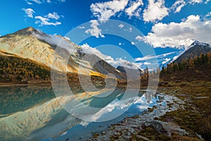 View from lake Akkem on mountain Belukha near board between Russia and Kazakhstan during golden autumn