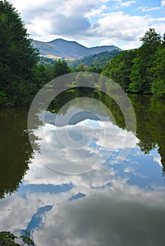 View of Lake Aydat in Auvergne, summer and cloud reflections