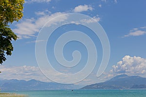 View of Lake Garda in Italy. Daytime. Calmness. Nobody. Nature. Panoramic view. Blue clear water. Landscape.