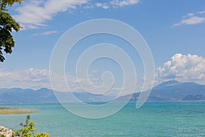 View of Lake Garda in Italy. Daytime. Calmness. Nobody. Nature. Panoramic view. Blue clear water. Landscape.