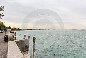 View  of Lake Garda from the promenade of the Sirmione town in Lombardy, northern Italy