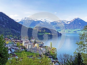 View of Lake Lucerne or Vierwaldstaetersee with Vitznau settlement and Swiss Alps in the background