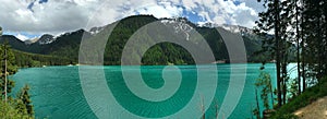 View of the lake and mountain peaks and rocks of the Dolomites in Italy in the Auronzo di Cadore in Tyrol under a overcast