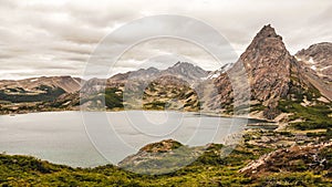 View on the lake and mountains around on the southernmost trek in the world in Dientes de Navarino in Isla Navarino, Patagonia, Ch photo