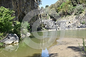 View of the lake shore with sand and rocks photo