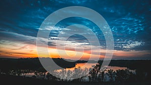 View of the lake at sunset on the top of a hill in Minnesota