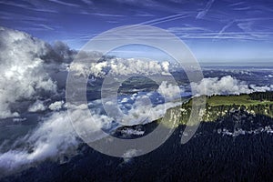 GView of Lake Thun and Bernese Alps including Jungfrau, Eiger and Monch peaks from the top of Niederhorn in summer, Switzerland