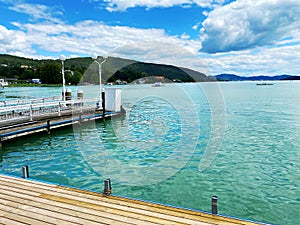 View of Lake Wörthersee in Velden from the jetty. Promenade along the Wörthersee Lake.