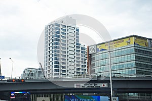 View landscape cityscape Thai and Japanese Friendship Bridge and high building tower office with thai people driving riding biking