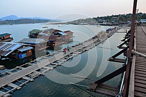 View landscape floating village and rafts hotel resort with Saphan Mon or Uttamanusorn bridge for thai people foreign travelrs