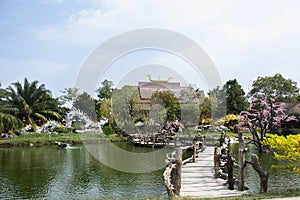 View landscape gardening garden park and wooden bridge crossing water pool pond of Wat Tham Khao Prathun Temple for thai people