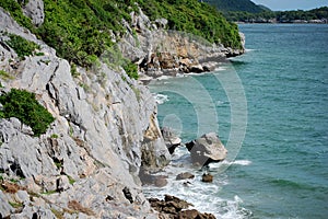 View landscape seascape and cliff of Ko Sichang island mountain with wave sea ocean beach for thai people and foreign travelers