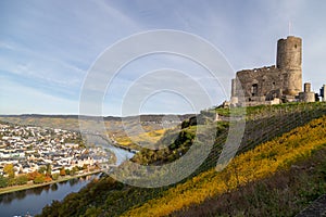 View at Landshut castle in Bernkastel-Kues on the river Moselle in autumn with multi colored vineyards