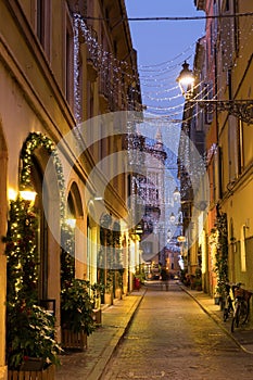 View on lanes with Christmas illumination in night Parma of Italy