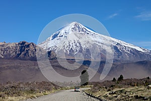 View of the Lanin Volcano from the road to Tromen Lake in Neuquen, Argentina. This volcano is covered by eternal snow