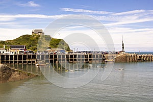 The view of Lantern Hill and Verity Statue in Ilfracombe Harbour, North Devon, England, UK