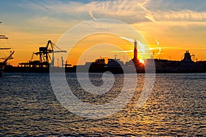 View of Lanterna (lighthouse) in the old port of city of Genoa at sunset, Italy