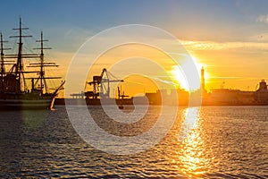 View of Lanterna (lighthouse) in old port of the city of Genoa at sunset, Italy