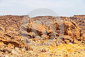 A view of large boulders and eroded sandstone rock in Twyfelfontein in Namibia