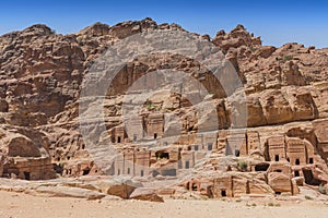 View of large cliff side tomb carved from the beautiful richly colored sandstone in the ancient city of Petra, Jordan