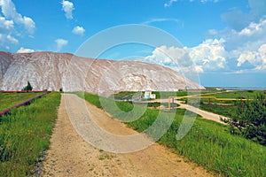 View of a large mountain of processed ore. Mining