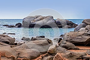 View of large rocks along the shore of the South China Sea. Sky Grottoes Park, Sanya, China