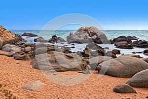 View of large rocks along the shore of the South China Sea. Sky Grottoes Park, Sanya, China