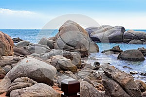 View of large rocks along the shore of the South China Sea. Sky Grottoes Park, Sanya, China