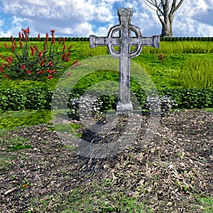 View of a large, well-groomed grave in a cemetery with plants