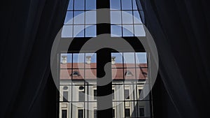 View from large window of old castle on wall of the palace