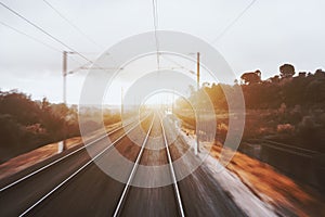 View from last carriage of fast train on railways