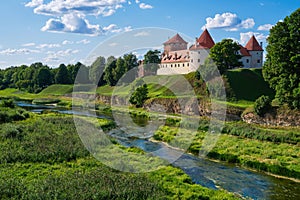 View of Latvian tourist landmark attraction - ruins of old medieval Bauska castle and the remains of a later palace. Bauska city