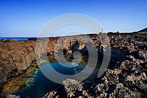 View of the lava beach of Linosa Called Piscine