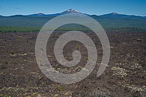 View of the lava flow from Phil Brogan viewpoint in Lava Lands Newberry Volcano National Monument. Mt. Bachelor in background