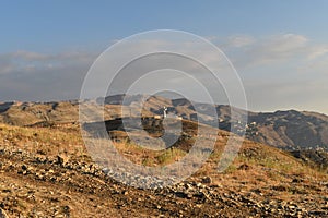 View of lebanese mountain summit of Faraya with monumental statue of Saint Charbel