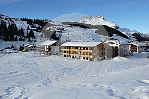 View of Lech village and ski piste in Austria at Winter