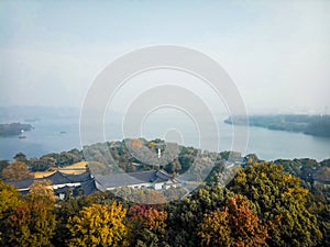 View from Leifeng Pagoda Hangzhou West Lake autumn scenery .mountain range at sunrise sunset orange sky beautiful landscape .