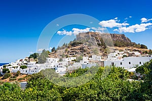 View of lemon trees and Acropolis of Lindos Rhodes, Greece