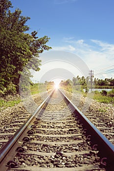 View of the length of railway,flare added,selective focusmeanThere light at the end of the tunnel, success way