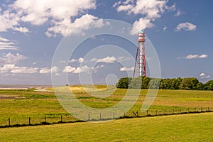 View on the lighthouse of campen near emden, north sea, germany