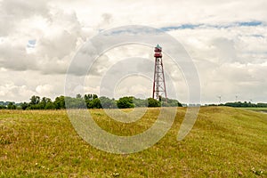 View on the lighthouse of campen near emden, north sea, germany