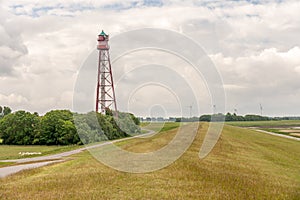 View on the lighthouse of campen near emden, north sea, germany