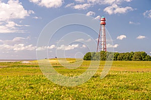 View on the lighthouse of campen near emden, north sea, germany