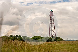 View on the lighthouse of campen near emden, north sea, germany