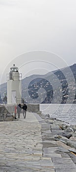 View of the lighthouse of city of Camogli, Genoa Province, Liguria, Mediterranean coast, Italy