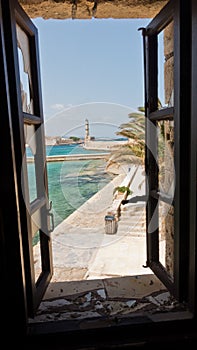 A view of a lighthouse at the old Venetian harbor, city of Chania, Crete island