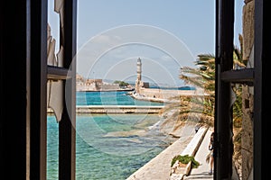 A view of a lighthouse at the old Venetian harbor, city of Chania, Crete island