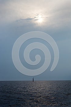 View of the lighthouse in the sea during twilight