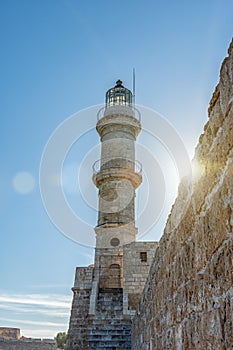 View of lighthouse in venetian harbor in Chania city on Crete island, Greece